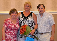 New Castle County Head Start, Inc. program coordinator Judy Guttenplan and Executive Director Jeff Benatti congratulate Debbie Reed (center) on receiving the 2011 Lucy H. Borda Award. 
