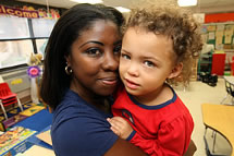Photo of woman holding child